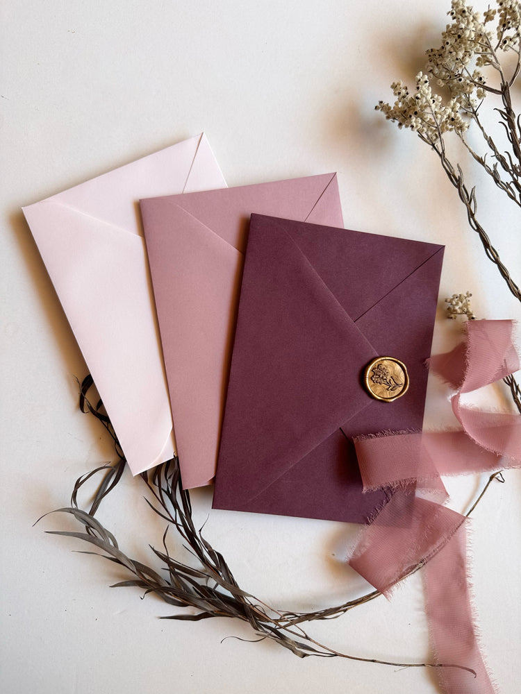 
                  
                    Load image into Gallery viewer, Floral monogram letterpress wedding invitation in burgundy, pink and nude with wax seal and envelopes.
                  
                