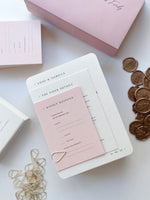 Modern and minimalist pink wedding invitation with wax seal.