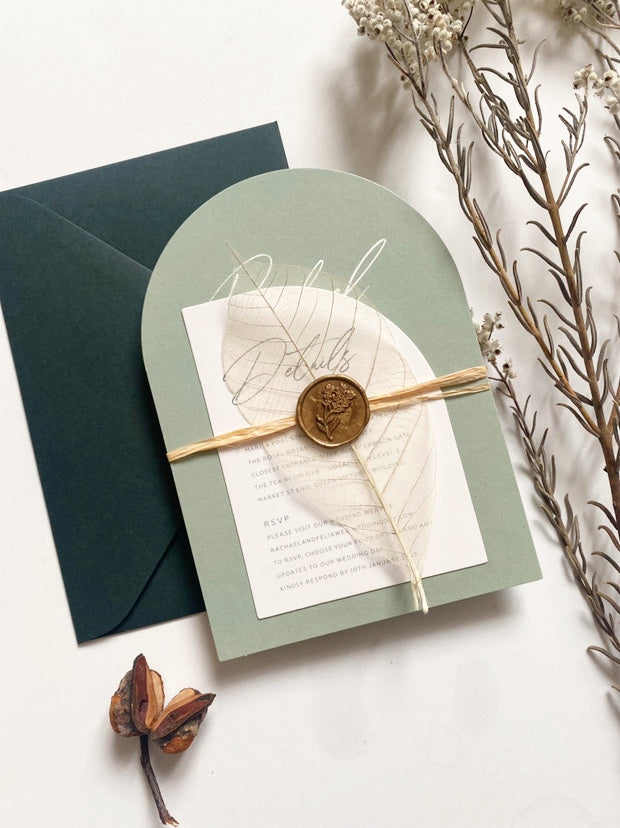 
                  
                    Load image into Gallery viewer, Green Wedding Invitation with Hunter Green Envelopes, assembled with skeleton leaf, raffia and wax seal.
                  
                