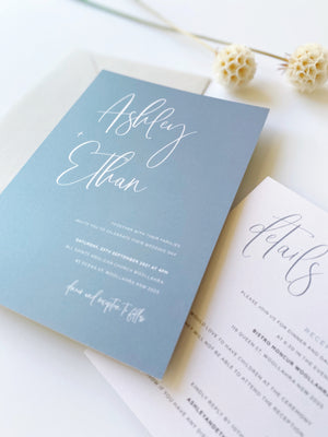 
                  
                    Load image into Gallery viewer, Ashleigh&amp;#39;s Calligraphy Wedding Invitation in dusty blue, printed on 250gsm pearlescent card stock.
                  
                